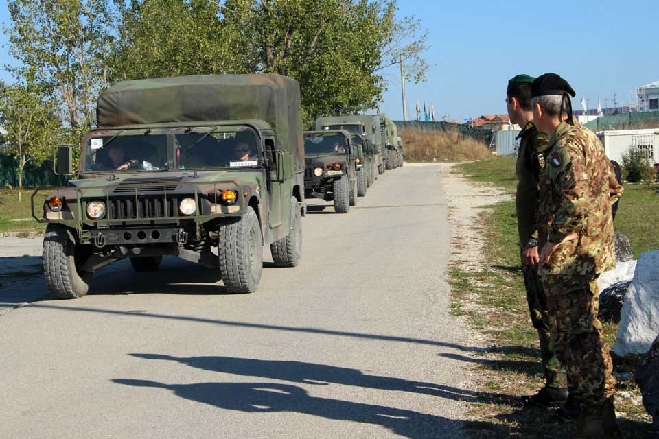 COM KFOR Major General Fungo and the departing convoy from Film City Pristina Kosovo