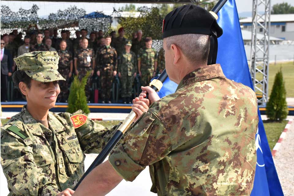 Allied Joint Force-Naples Commander, U.S. Navy Admiral Michelle Howard hands over the official flag of Command to the new KFOR Commander Major General Giovanni Fungo.