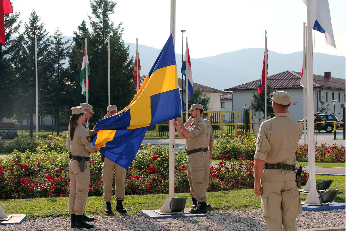 EUFOR soldiers lower the Swedish Flag