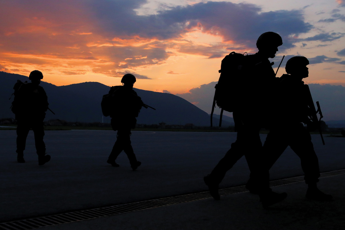 As the sun sets over Camp Butmir, Austrian troops from the 6th Mountain Warfare Brigade finish a long day’s integration training with EUFOR’s Multinational Battalion during the preparation for Exercise Quick Response 2019.