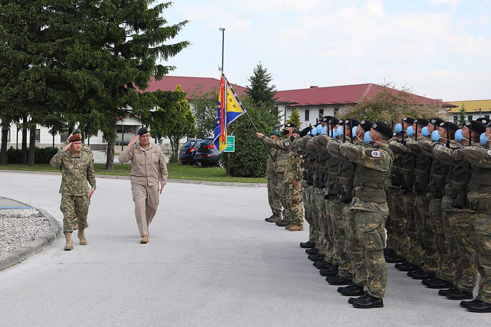 Lieutenant General Daniel Petrescu is escorted by COMEUFOR Major General Alexander Platzer through the honour guard upon his arrival